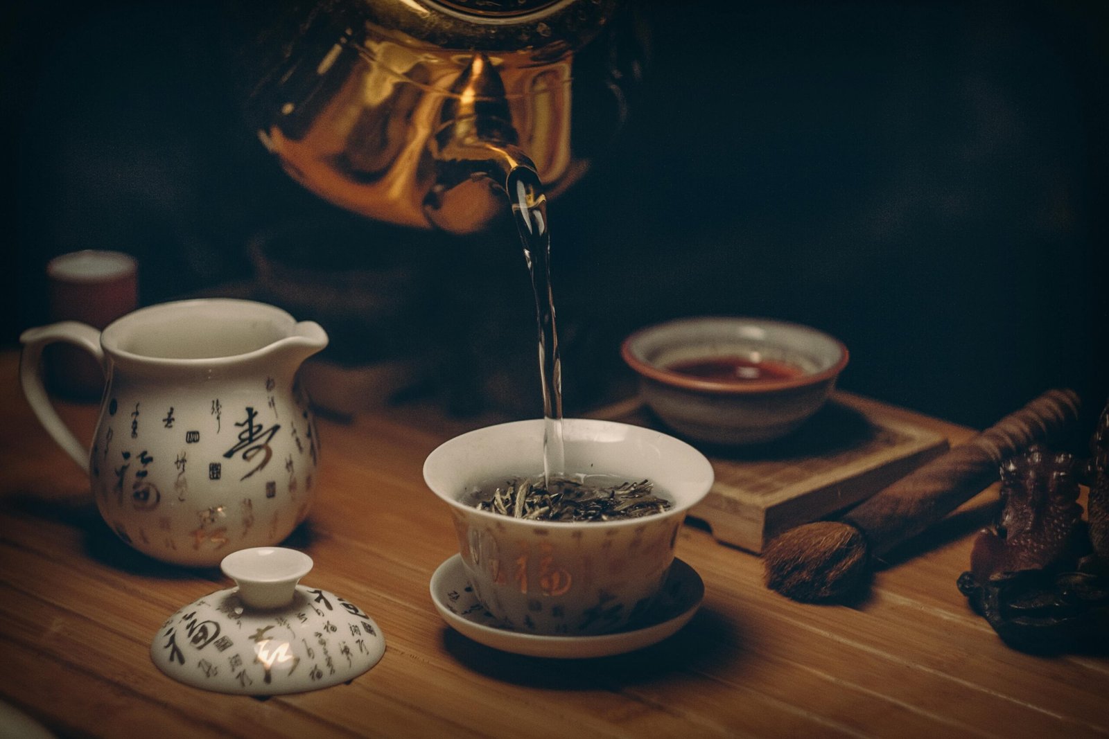 pexels photo 230477 230477 Artistic depiction of a traditional Chinese tea ceremony with porcelain teaware and hot water pour.